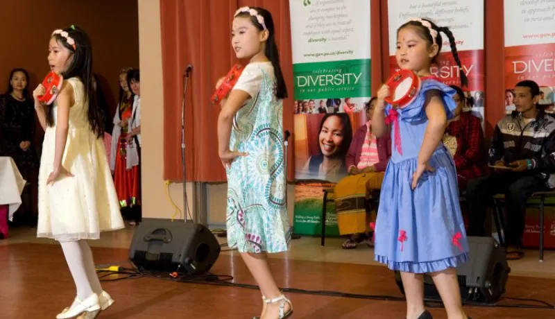 Young girls dance at a diversity festival 